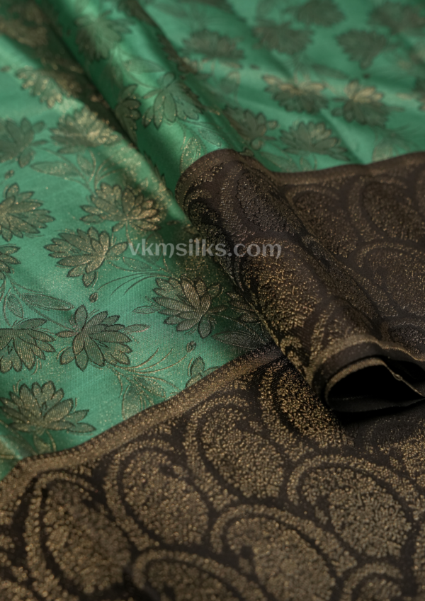 Elegant Emerald Green Silk Saree with Black Zari Border