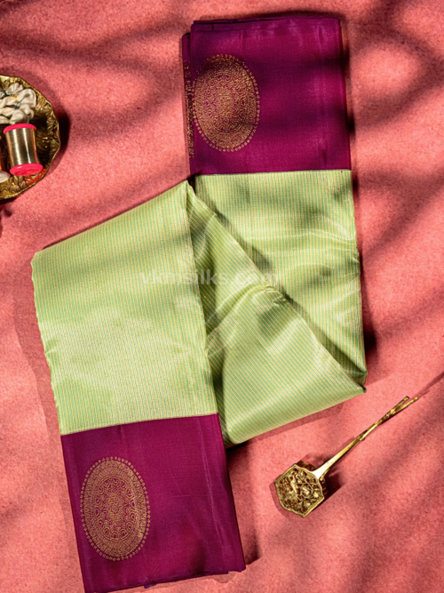 Green podi kattam and magenta chakram butta bordered pure kanjivaram